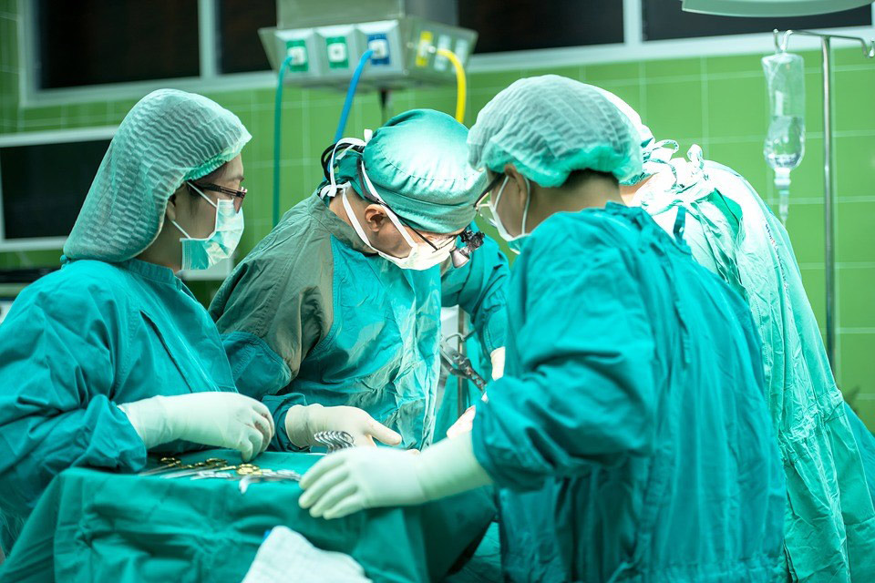 Operation room with surgeons performing surgery