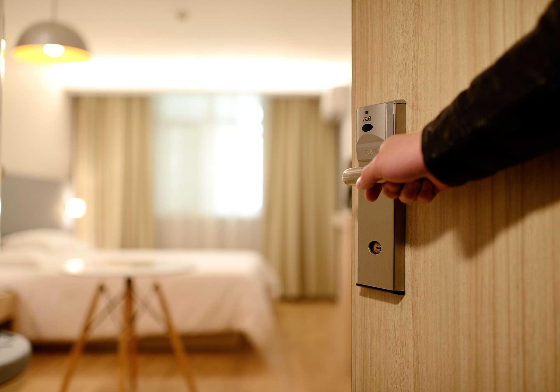hotel personnel opening the door to a room to be hospitable