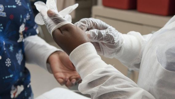 medical student putting on gloves